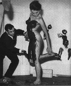 Yves Klein with painted model Yves Klein with painted model
