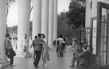 Students socializing on the porch of Lee Hall, the center of campus life