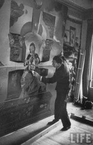 Salvador Dalí in his studio painting The Madonna of Port Lligat(1950)