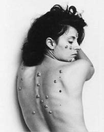 Hannah Wilke's <i>S.O.S. Starification Series</i>(1974) - distorts her classically beautiful body to present her ideas