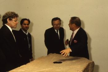 From left to right: Henry Meyric Hughes, Anish Kapoor, Giulio Andreotti, and Giovanni Carandente, Artistic Director of the Biennale, with Kapoor's sculpture, <i>Void Field</i>, at the 1990 Venice Biennale