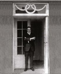 Mies standing in a doorway of the Riehl House in Potsdam, Germany, his first completed commission, about 1907