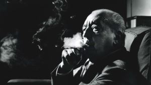 Mies enjoying a puff on his ubiquitous cigar