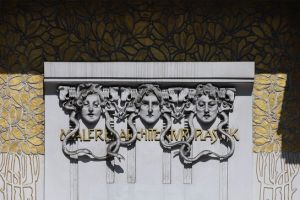 The three Gorgons by Othmar Shimkowitz on the facade of the Secession Building, Vienna, The text behind reads “Maler Architektur Plastik” (Painting Architecture Sculpture) (1898)