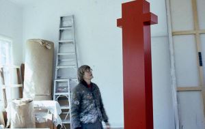 Anne Truitt contemplates one of her large sculptures in her studio in Washington, D.C.
