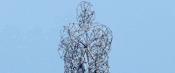 Detail of Exposure (2010), a 85-foot crouched figure in Lelystad, Netherlands.
