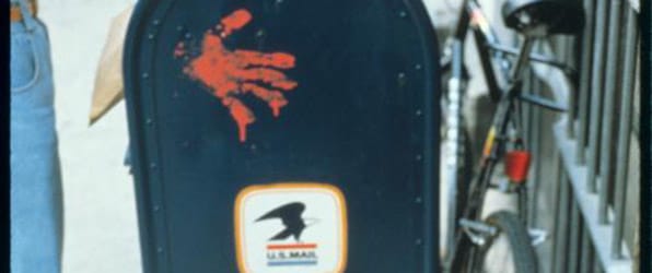 Red handprints on mailboxes as part of Gran Fury's <i>The Government Has Blood on Its Hands</i>, 1988