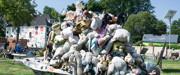 <i>Noah's Ark</i> (2001) Stuffed animals are seen in a boat on a vacant lot as part of Guyton's street installation in Heidelberg Street, Detroit