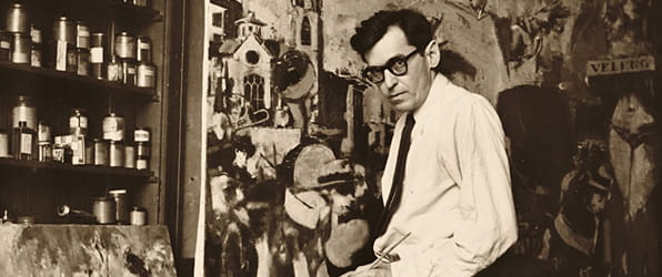 Jack Levine working on a painting.