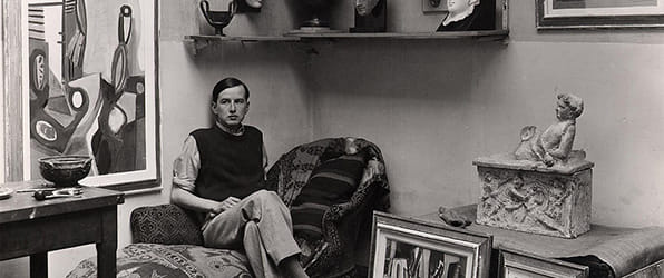 Paalen pictured in his studio in Paris c.1933 with paintings and items from his personal collection