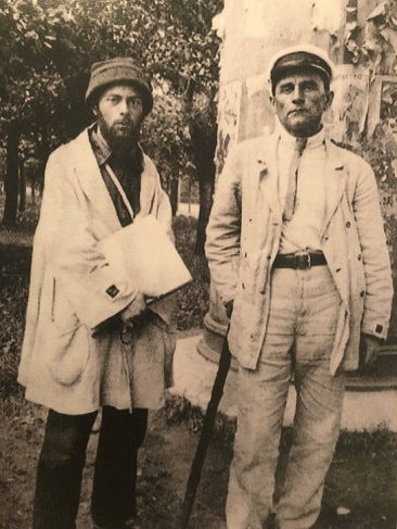 El Lissitzky (on the left) and Malevich have black squares on the sleeves of their jackets, displaying their union in the UNOVIS group