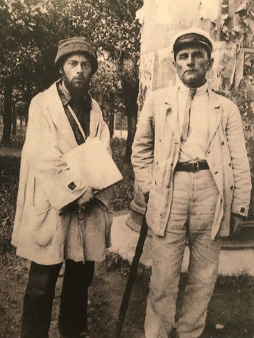Kazimir Malevich and El Lissitzky both have a black square on the sleeves of their jackets, displaying their union in the UNOVIS group