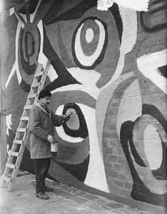'Karel Appel, making a wall-painting in Rotterdam' in 1955