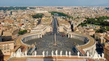 Bernini's colonnade (1656-1667), which, circling St. Peter's Square, emphasized the enfolding movement of the church as well as the vertical movement of the city toward St. Peter's Basilica, its statue lined-roof visible in the foreground.