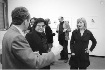 Klaus Honnef in conversation during the vernissage of the Karl Blossfeldt exhibition, right Hilla, in the background Bernd Becher, Rheinisches Landesmuseum Bonn. Photograph by Franz Fische (1976)