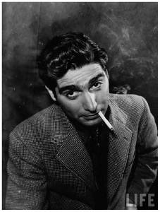 <i>Portrait of Photographer Robert Capa Blowing Smoke From Cigarette</i> (1942)