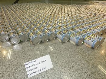 In <i>Baby Formula</i> (2013) Ai Weiwei arranged more than 1800 cans of baby formula in the shape of China as a commentary on the baby formula scandal that arose in China in 2008, when a number of children were killed or made critically ill after drinking contaminated milk.