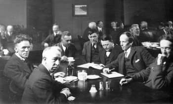 1920 photograph of six of the members of Canada's modern art movement, Group of Seven which were highly influential on artist Emily Carr. Those pictured include from left to right: Frederick Varley, A.Y. Jackson, Lawren Harris, non-member Barker Fairley, Frank Johnston, Arthur Lismer, and J.E.H. MacDonald.