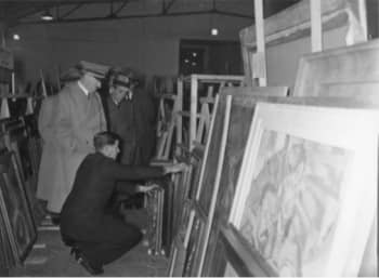 C. 1933-34 photograph of Adolf Hitler examining artwork