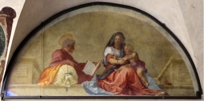 <i> مادونا ديل ساكو (مادونا ذات الكيس) </ i> (1525).  تصور هذه اللوحة الجدارية المتأخرة من الحياة المهنية الباقي ، التي التقطت أثناء رحلة مريم العذراء إلى مصر مع يوسف والطفل المسيح.  تم تأطير الثلاثي على كلا الجانبين بواسطة عمود عمودي وبواسطة مخطط رشيق للكنيسة المعمارية.