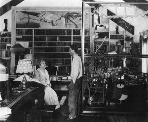 Photograph of Katherine Dreier and Marcel Duchamp with his works <i>Tu m</i>' and the <i>Large Glass</i> in her study in The Haven