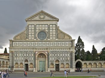 A photograph of Leon Battista Alberti's façade of Santa Maria Novella depicting the classical design, and the scroll motifs that were, subsequently, widely adopted. The building is home to Masaccio's <i>Holy Trinity</i> (1428) Giotto's <i>Crucifix</i> (c. 1290), and other noted masterworks.