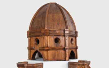 This photograph depicts Brunelleschi's wooden model (1418) of his dome for the Florence Cathedral, which he used to guide his construction crews and which he deliberately left incomplete, planning to reveal fuller details only when needed.