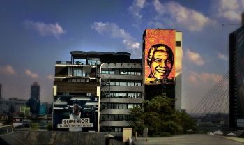 The <i>Purple Project</i> (2014) was a multistory mural produced in Johannesburg, honoring South African statesman Nelson Mandela.