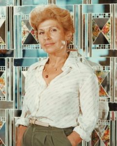 Monir Shahroudy Farmanfarmaian, photographed with one of her mirror works in the 1950s.