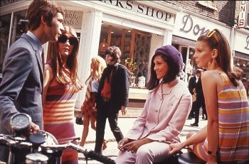 This photograph <i>Swinging London: Teenagers in London's Carnaby Street</i> (c. 1966) depicts several youth fashion trends.