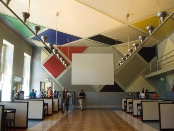 Theo van Doesburg's design for the L'Aubette dance hall (1926-27) combines architecture, painting, and applied design.