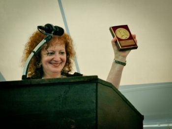 Goldin speaking at the MacDowell Colony in New Hampshire (2012). In her acceptance speech, granted to honour the most talented contemporary artists working today, Goldin said, “I was given a camera... and that's how I learned to speak.”
