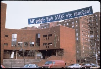 Banner made by Gran Fury hung in front of Henry Street Settlement in Manhattan, 1988.