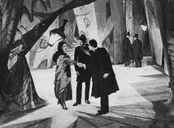 <i>The Cabinet of Dr. Caligari</i> (1920). Told from the first-person perspective of an asylum inmate, the film, now accepted universally as a masterpiece of European art cinema, used Heckel inspired angular and distorted painted woodcut-like sets to represent the interiority of the troubled imagination of its narrator.