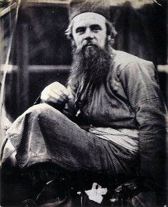 Julia Margaret Cameron's photograph of Hunt in eastern costume, taken in 1864.