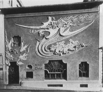 August Endell's <i>Atelier Elvira</i> (1897-1898), depicting a red and gold dragon-like form within a wave-like element against a green background, emphasized the whiplash to create an almost abstract pattern.