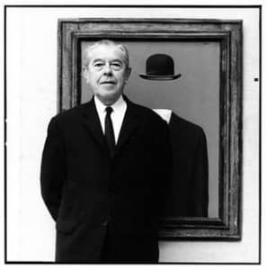 Rene Magritte, in front of his painting The Pilgrim. Photograph by Lothar Wolleh (1967)