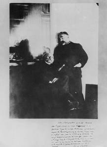In this photograph taken by Degas (INHA, Paris), Mallarmé is pictured (standing) with Pierre-Auguste Renoir (seated) (1895).