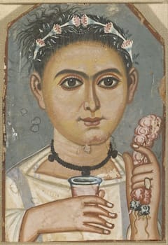 <i>Boy with a Floral Garland in His Hair</i> (c. 200-230 C.E.), one of many Fayum mummy portraits which use “tempera” paint.