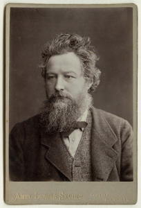 Portrait of William Morris, aged 46, on a cabinet card, by Abel Lewis, printed by James Edward Bruton (1880), National Portrait Gallery.