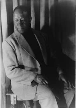 Gay African American painter Beauford Delaney (pictured here in 1952, one year before he relocated to France) was one of many Harlem Renaissance figures who moved permanently to the cultural and intellectual hub of Paris in the early twentieth century, where they faced less overt racism than they had in the U.S.