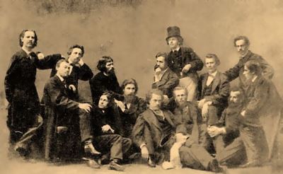 A photograph of the group involved in the “revolt of the fourteen”, who formed the Artel of Artists in 1863: (left to right) Venig, Zhuravlev, Morozov, Lemokh, Kramskoi, Litovchenko, Makovsky, Dmitriev-Orenburgsky, Petrov, Kreitan, Peskov, Shustov, Korzukhin, and Grigoryev.