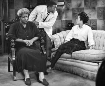 Pope.L directed a production of Lorraine Hansberry's 1959 Broadway play <i>A Raisin in the Sun</i> (pictured here), which deals with issues of racism and housing discrimination, but took the creative liberty of casting both Black and Caucasian actors as members of the same family.