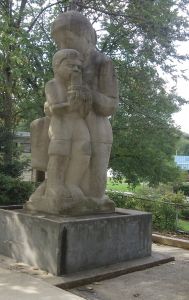 Although most WPA works were murals, several public sculptures were also commissioned. Female sculptor Lenore Thomas Straus was in her 20s when she carved <i>Mother & Child</i> (1939) at the Roosevelt Center in Greenbelt, Maryland.