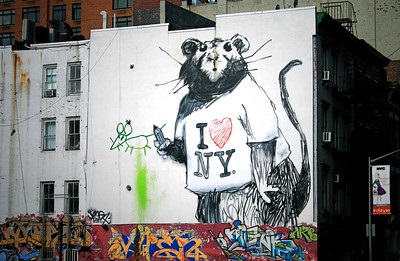 Street artist Banksy, who usually uses spray paint and stencils in his art, keeps his identity a secret. He frequently paints rats as a sort of self-portrait, as both animal and artist are city-dwellers, operating under cover of darkness, relying on their cunning and cleverness to survive.