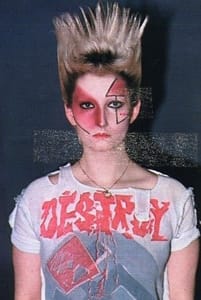 English actress and model, Pamela Rooke (aka Jordan Mooney) was associated with the archetypal punk style. Here she wears Westwood's iconic 'Destroy' T-shirt, featuring a swastika and ripped holes.