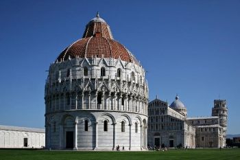 The Baptistry (1153) in Pisa, with the Cathedral (1063-1092) to the right, behind it, and the Campanile (1172) in the distant right. Photo by Massimo Catarinella.