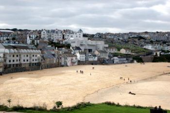 View across Porthmeor Beach in St Ives, where members of the Penwith Society set up artist studios in a renovated a fishing loft.