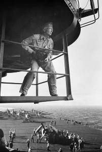 Edward Steichen photographed above the deck of the aircraft carrier USS Lexington by Lt Victor Jorgensen, (November, 1943)