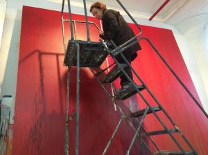 Pat Steir working in her Chelsea studio, dripping paint onto a canvas